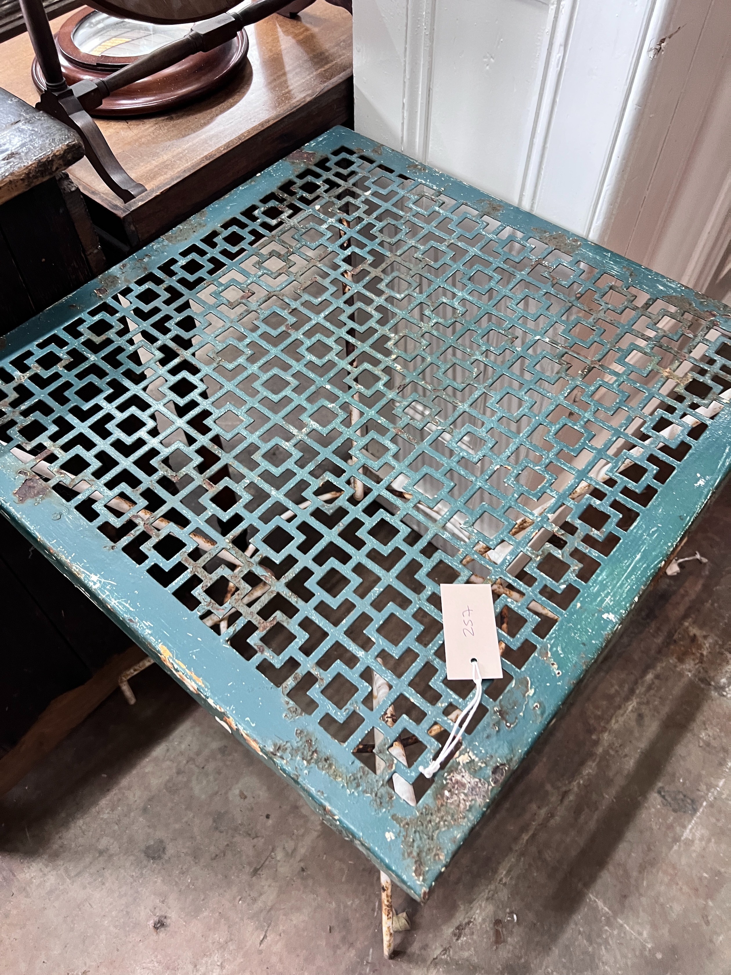 A painted wrought iron garden table, width 56cm *Please note the sale commences at 9am.